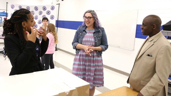RCS board member Michelle Williams-Ward (left) chats with RMS teacher Christine Beckner (middle) and Covenant Missions Community Operations Liaison Pha Burns (right).