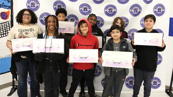 Roseville Middle School students display the new Meta Oculus 2 VR headsets.