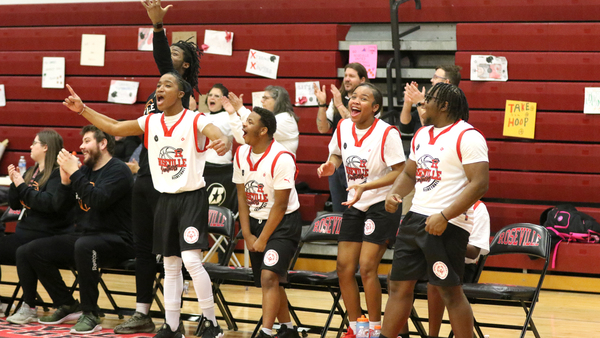The bench erupts in excitement after a first half Panthers hoop