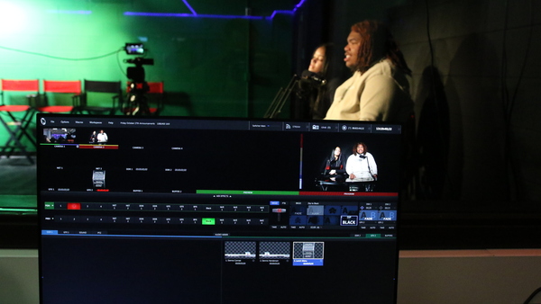 Seniors Dennis Henderson and Sienna Conrad anchor the afternoon announcements in the new studio.